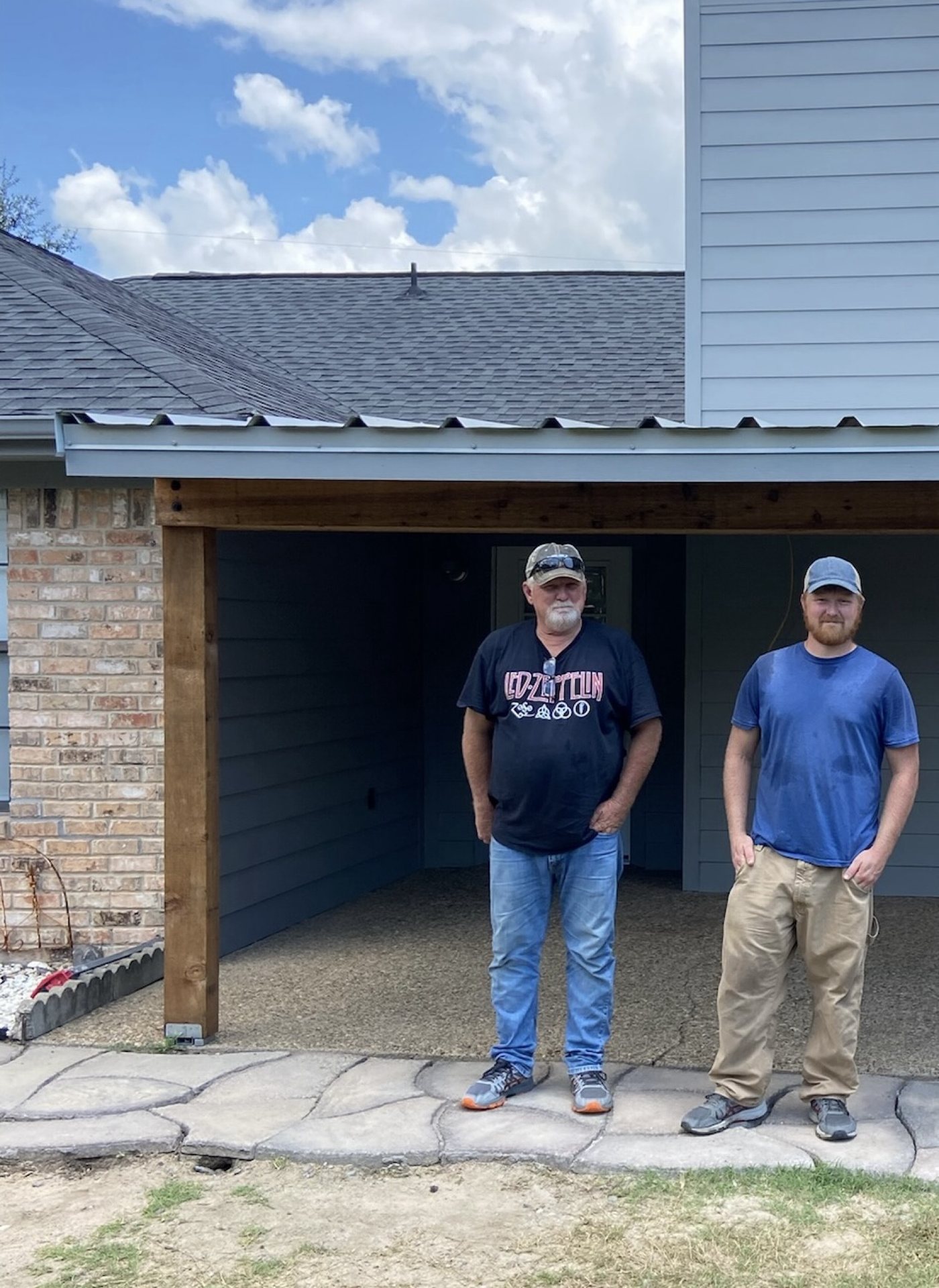 Robbie Reece and family in front of a finished East Texas reroof